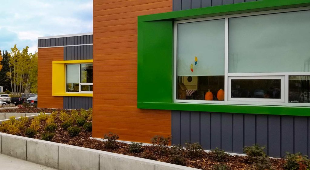 Ardrossan Elementary School exterior with green and yellow window frames